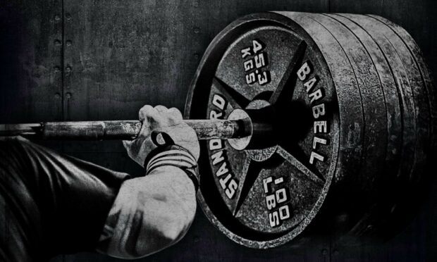A person gripping a heavy barbell for powerlifting weight training, HD Desktop Wallpaper