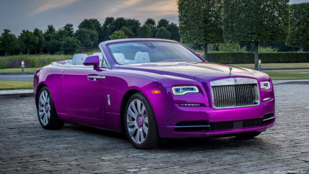 A purple Rolls Royce Dawn is parked on a stone paved area surrounded by trees and grass, 4K Desktop Wallpaper