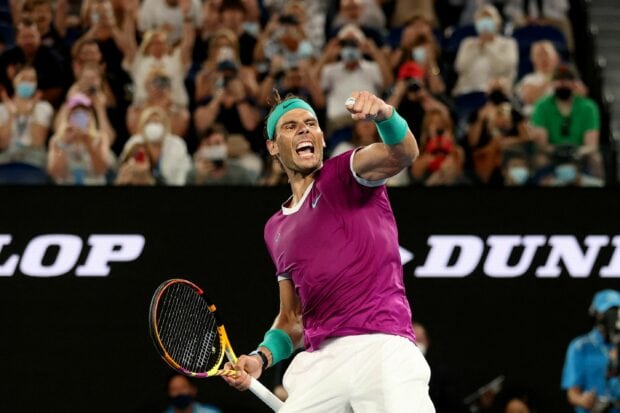 Rafael Nadal celebrating a tennis match victory with a clenched fist on court, 2K Desktop Wallpaper