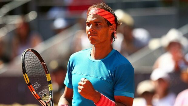 Rafael Nadal celebrates a successful point during a match while holding a tennis racket, HD Desktop Wallpaper