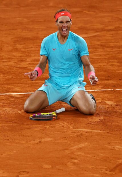 Rafael Nadal celebrating on a clay tennis court after a match, HD Mobile Wallpaper