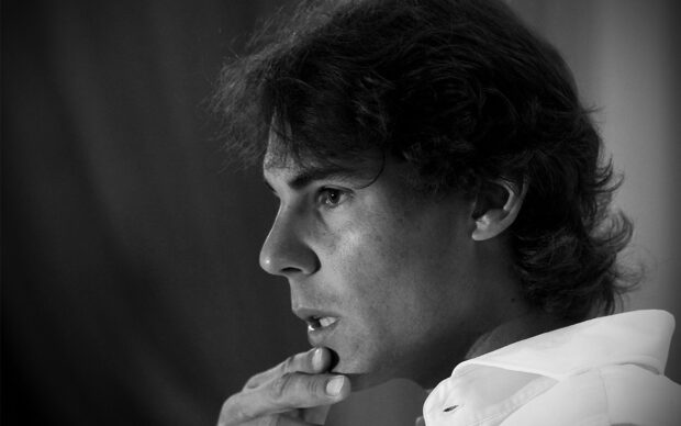 Rafael Nadal is concentrating deeply in a black and white portrait, HD Desktop Wallpaper