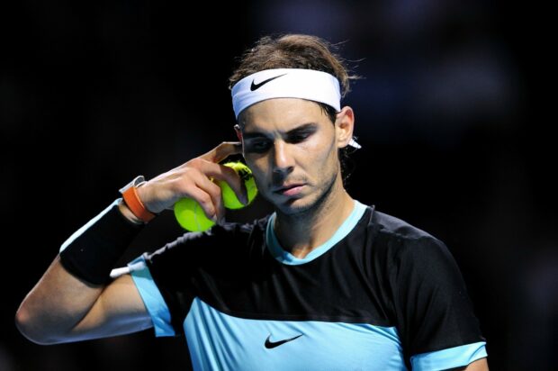 Rafael Nadal focused with tennis balls during match, 2K Desktop Wallpaper