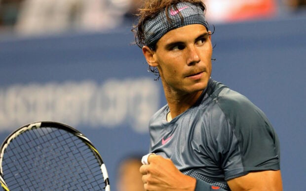 Rafael Nadal focused and holding tennis racket during the game, HD Desktop Wallpaper