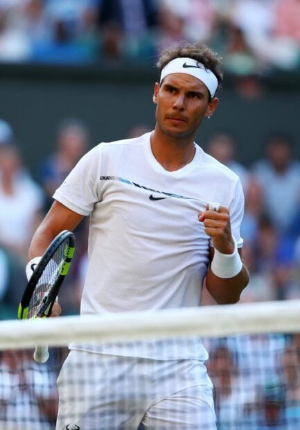 Rafael Nadal is focused and determined during a tennis match, 2K Mobile Wallpaper