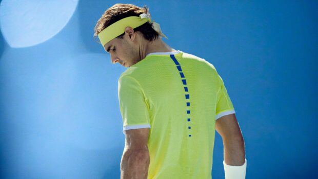 Rafael Nadal in focused moment wearing yellow shirt during a match, 4K Desktop Wallpaper