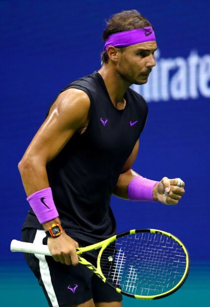 Rafael Nadal displays focus and strength during a tennis match, HD Mobile Wallpaper