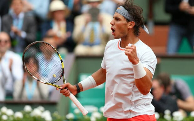 Rafael Nadal is celebrating a winning point during a tennis match, 2K Desktop Wallpaper