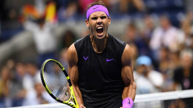 Rafael Nadal fiercely celebrates during a tennis match with a racket in hand, HD Desktop Wallpaper