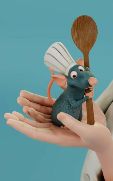 Ratatouille character holding a wooden spoon while sitting on a hand with a chef hat