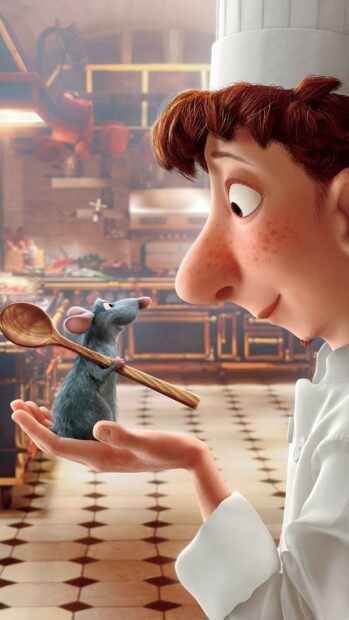 A chef holding a rat with a wooden spoon inside a kitchen setting