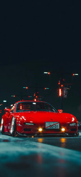A red Mazda sports car is parked on a wet street under streetlights at night, HD Mobile Wallpaper