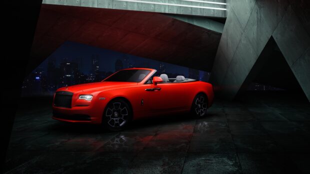 A red Rolls Royce Dawn is parked in a modern urban setting at night, 4K Desktop Wallpaper