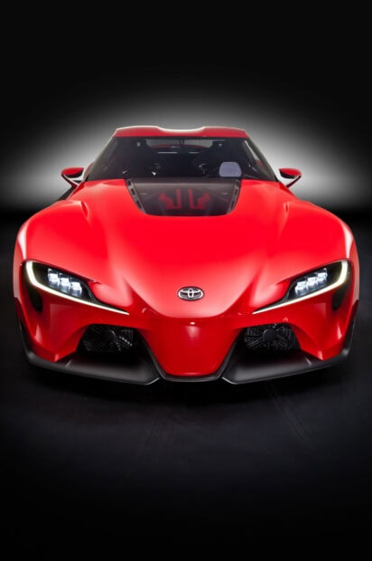 High-performance red sports car front view.
