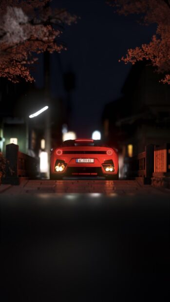 A red sports car is parked on a dimly lit street with glowing taillights and autumn trees, 2K Phone Wallpaper