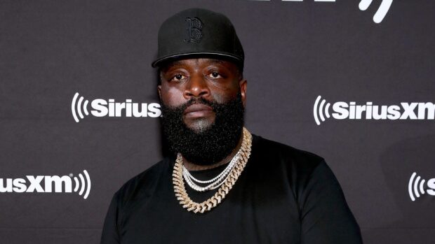 Rick Ross wears a black cap and gold chains standing in front of SiriusXM wall, 2K Desktop Wallpaper