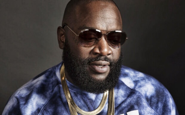 A close up portrait of Rick Ross wearing sunglasses and gold chains, 2K Desktop Wallpaper