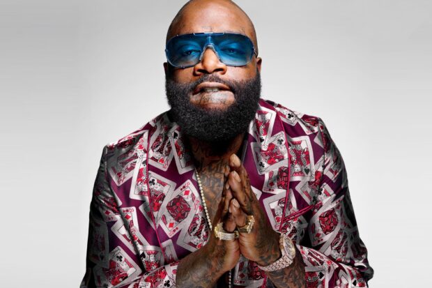 A close up of Rick Ross wearing a playing card suit and blue glasses, HD Desktop Wallpaper