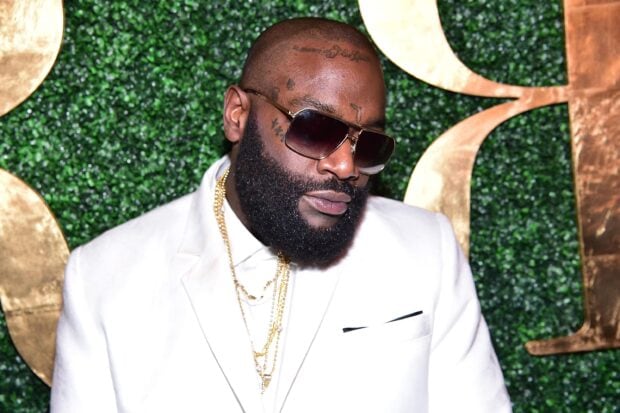 A close up of Rick Ross wearing sunglasses and a white suit at an event, 2K Desktop Wallpaper