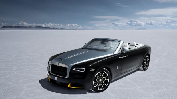 A black Rolls Royce Dawn parked on a white salt flat under a blue sky, 4K Desktop Wallpaper