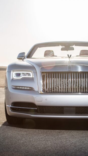 A silver Rolls Royce Dawn with sunlight reflecting on its front grille, 2K Mobile Wallpaper