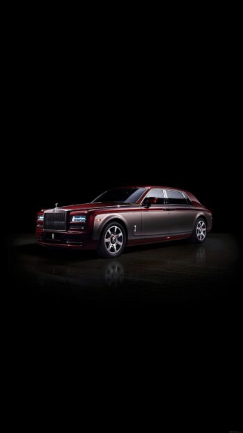 A red and silver Rolls Royce Phantom is shown in a studio with a black background, HD Phone Wallpaper