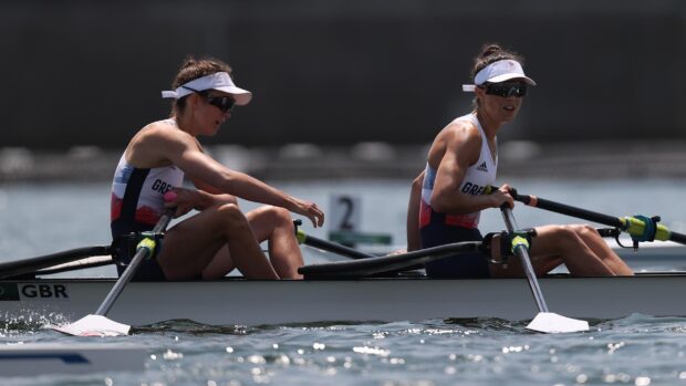 Two athletes rowing in a boat during a competitive rowing race