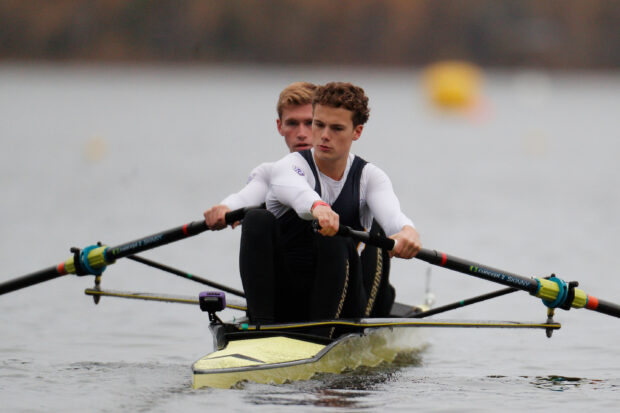 Two athletes rowing in a scull demonstrating teamwork and strength on the water
