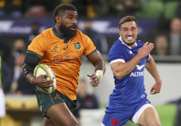 A rugby league player in an orange jersey runs while a player in blue chases him, 2K Desktop Wallpaper