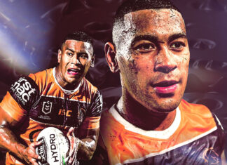 Jamayne Isaako is shown playing rugby league while holding the ball and running on the field, HD Desktop Wallpaper