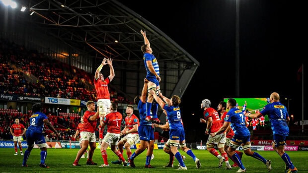Rugby League players compete in a lineout during a night match in the stadium, HD Desktop Wallpaper