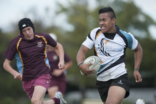 A rugby league player is running with the ball while an opponent chases him during a match, HD Desktop Wallpaper