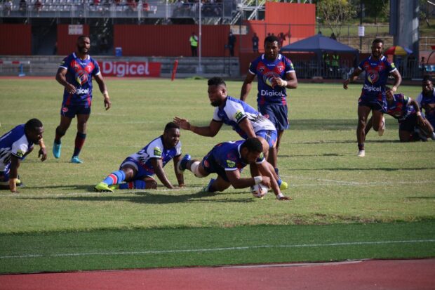 Rugby league players in blue uniforms compete on the grassy field during a match, HD Desktop Wallpaper