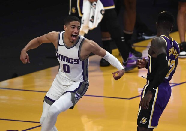 Sacramento Kings player celebrating during a basketball game against the Lakers on the court
