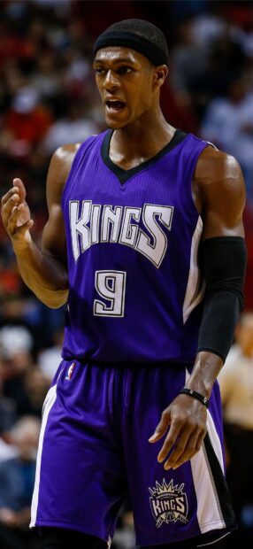 A Sacramento Kings player wearing a purple jersey with number 9 during a basketball game