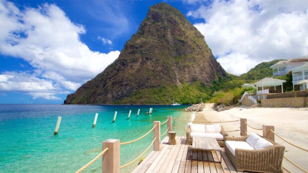 A peaceful beach scene with the Pitons and tropical greenery in Saint Lucia