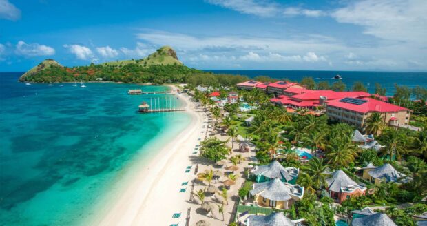 A stunning aerial view of Saint Lucia with a white sandy beach and clear turquoise water