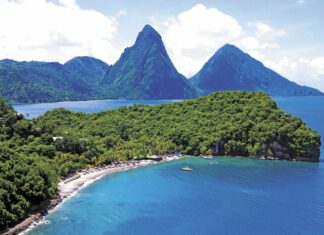 Beautiful lush Saint Lucia landscape with blue sea and mountainous terrain