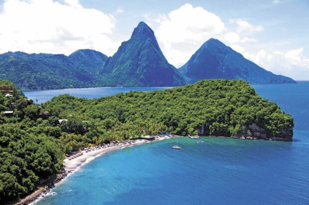 Beautiful lush Saint Lucia landscape with blue sea and mountainous terrain