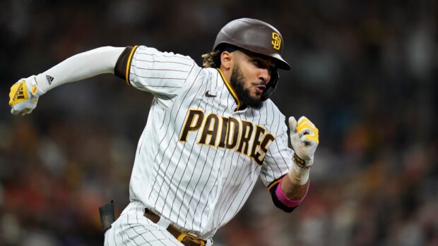 A San Diego Padres player is running during a game wearing the team uniform, HD Desktop Wallpaper