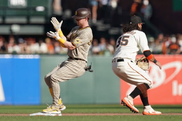A San Diego Padres player slides safely to the base during a game action, 2K Desktop Wallpaper