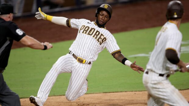 A San Diego Padres player slides during a baseball game action, 4K Desktop Wallpaper