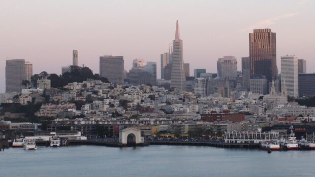San Francisco skyline at dusk with clear sky and waterfront view