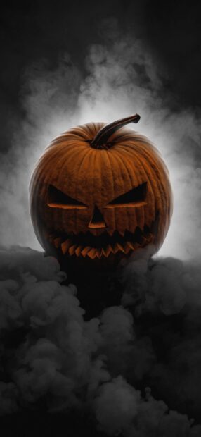 A menacing Halloween pumpkin with a carved sinister face surrounded by smoke, HD Phone Wallpaper