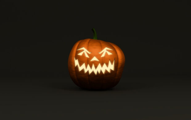 A glowing Halloween pumpkin with a scary carved face in the dark, HD Desktop Wallpaper