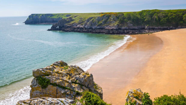 A beautiful coastline with sandy beach and rocky cliffs in Wales showcasing nature, HD Desktop Wallpaper