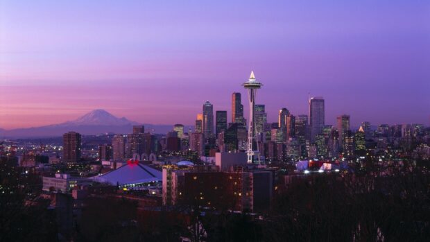The Seattle skyline shows the Space Needle and surrounding buildings at dusk with a purple sky, HD Desktop Wallpaper