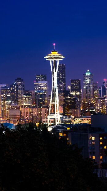 The Seattle skyline wallpapers show the illuminated Space Needle against a dark blue sky, HD Phone Wallpaper