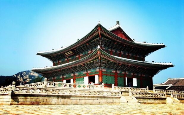 Traditional Korean palace architecture in Seoul Korea under clear blue sky
