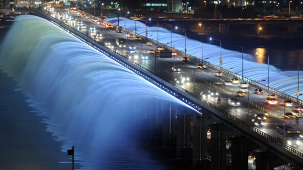 Nighttime view of Banpo Bridge showing fountain streams in Seoul Korea